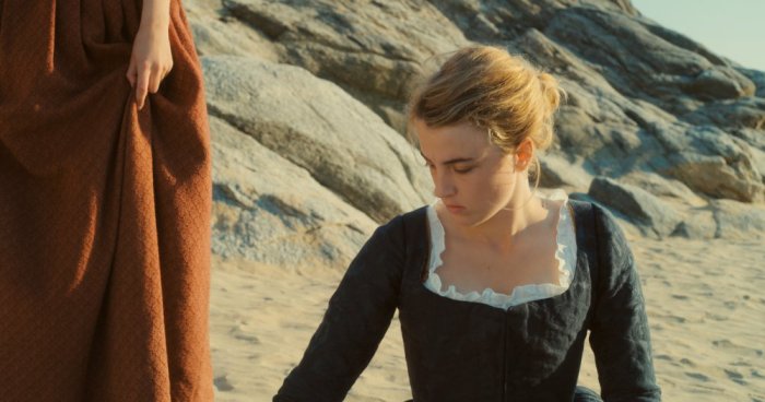 portrait-of-a-lady-on-fire-2019-003-adele-haenel-kneeling-to-hem-of-orange-dress